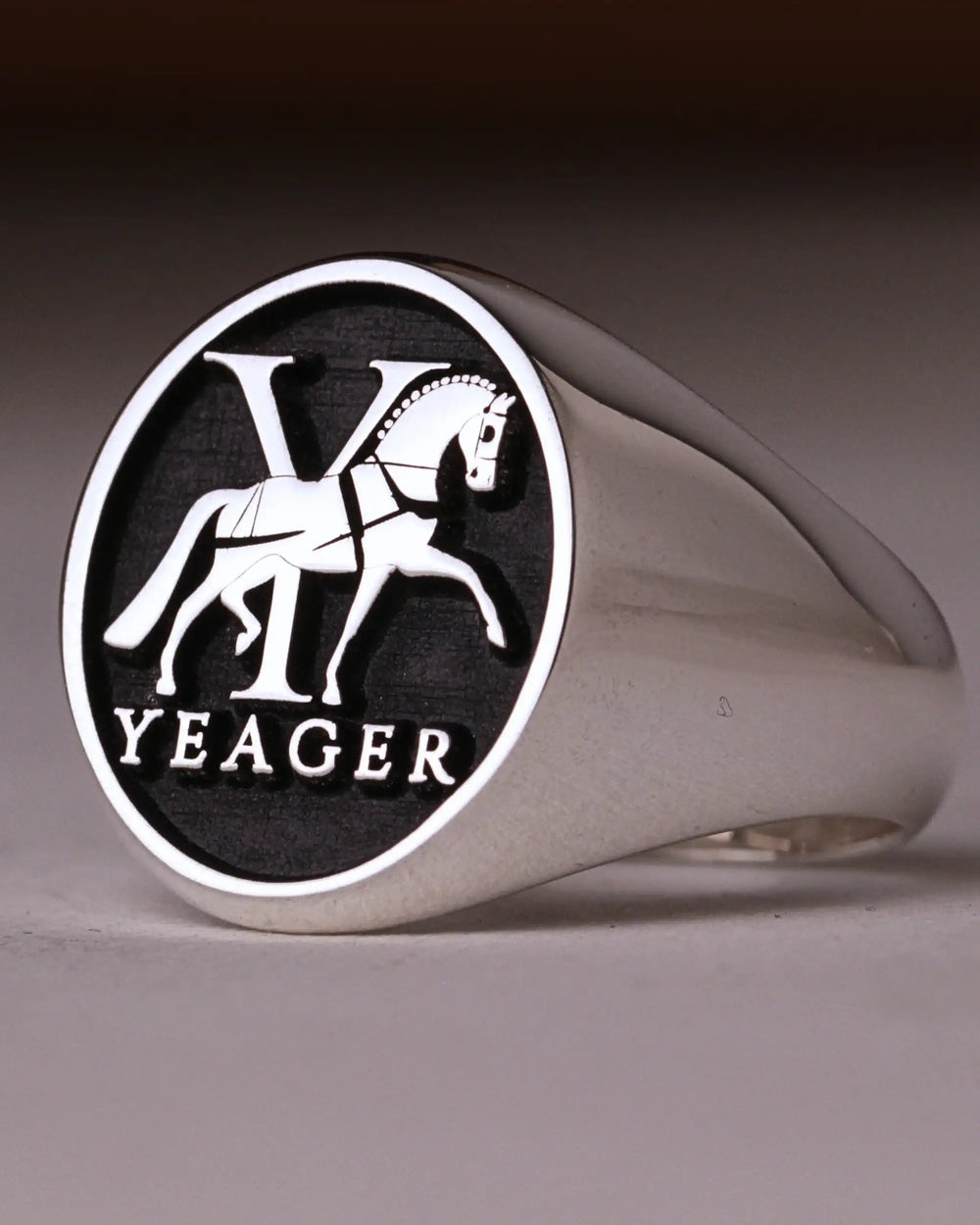 Silver-finish signet ring engraved with a Y monogram, a prancing horse and the name Yeager on a black background