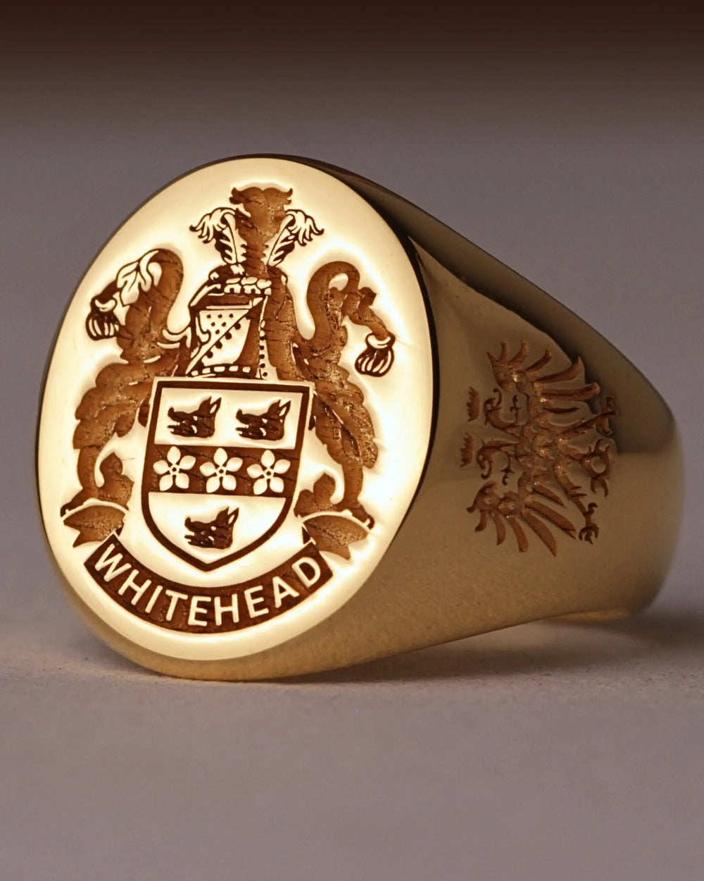 Gold-finish signet ring engraved with the Whitehead family crest and an eagle on the side