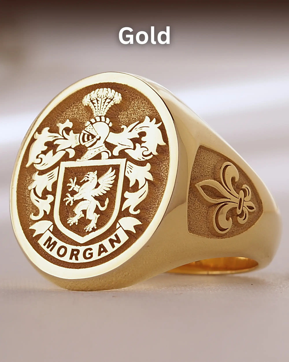 Gold-finish custom signet ring with the Morgan family crest engraved and a fleur-de-lis on the side